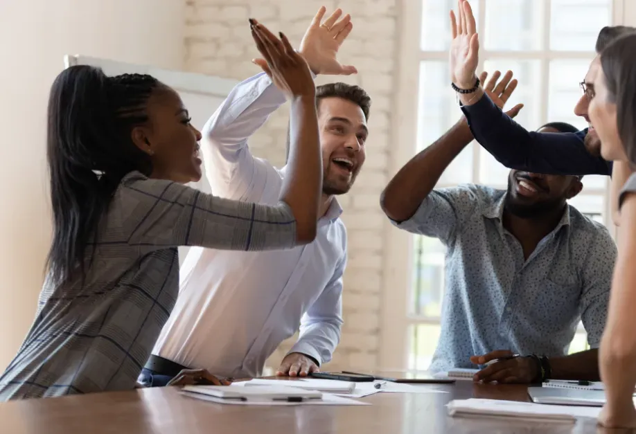 A group of employees clapping their hands